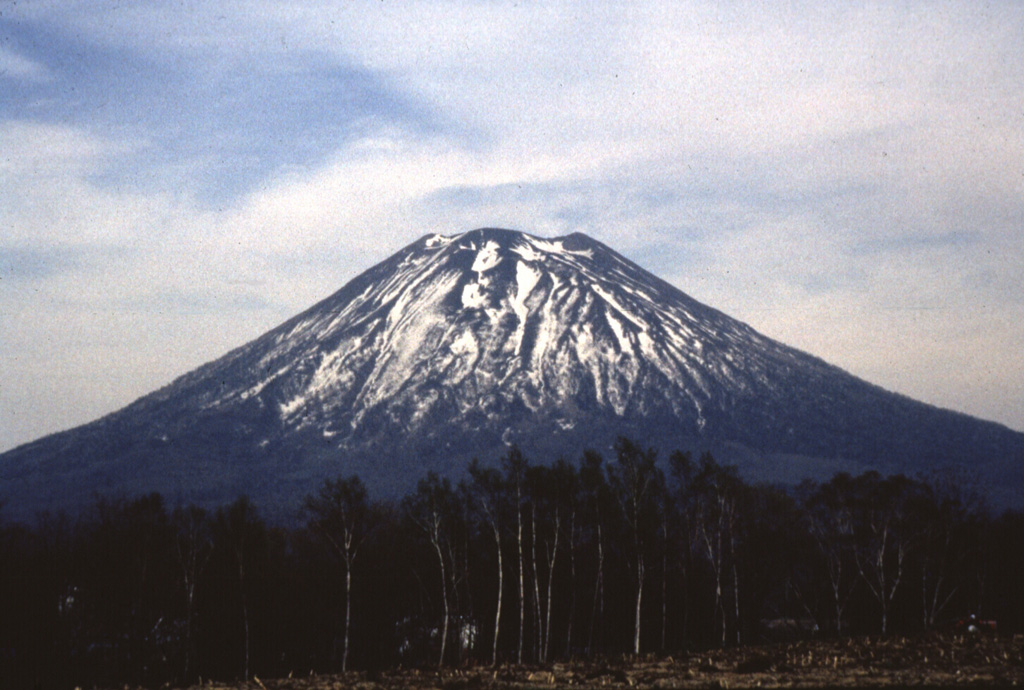 Yoteizan volcano is seen here from the W. The deep radial gullies on the flanks are less pronounced on this side. Photo by Shin'ichiro Gomi, 1997 (Hokkaido University).