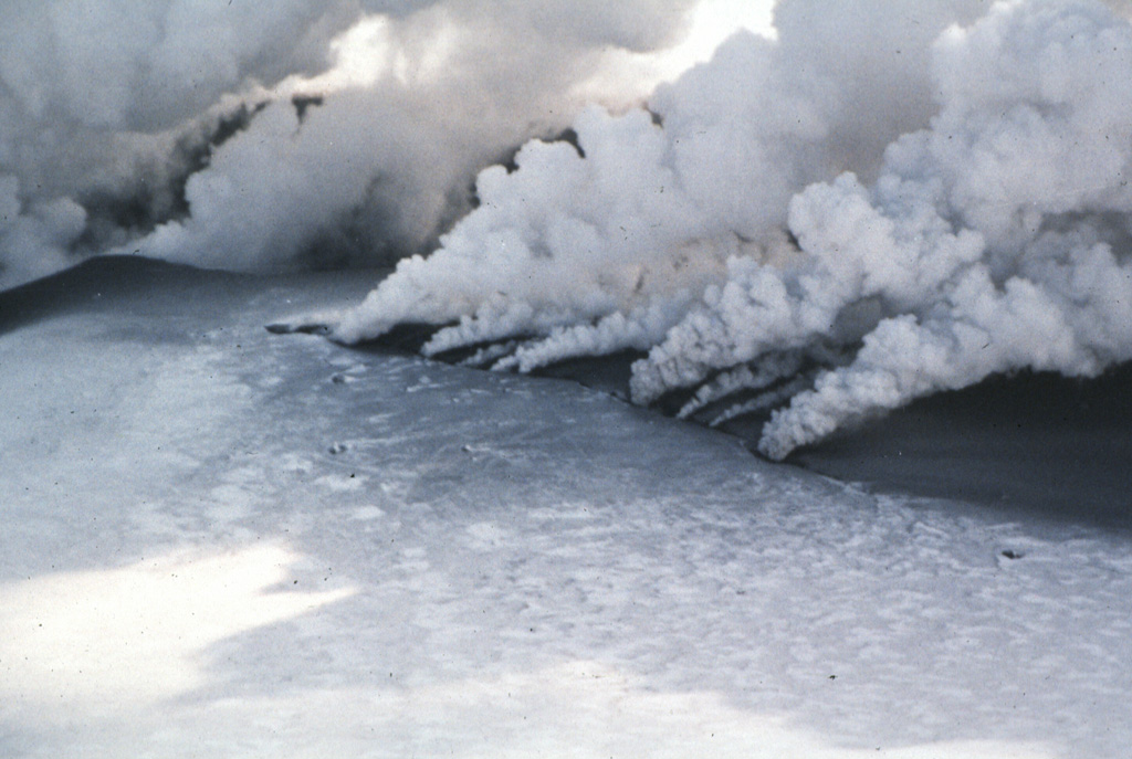 Gas-and-steam plumes emanate from a new eruptive fissure cutting the summit of Japan's Komagatake volcano on 7 March 1996. A phreatic eruption began the evening of the 5th and deposited ash onto snow. The eruption took place from the 1929 crater and from a 200-m-long N-S fissure on the S flank. Eruptive activity, producing steam-rich ash plumes, was strong until 7 March and declined after 12 March. Photo by the Shin Engineering Consultant Company, 1996 (courtesy of Mitsuhiro Yoshimoto, Hokkaido University).