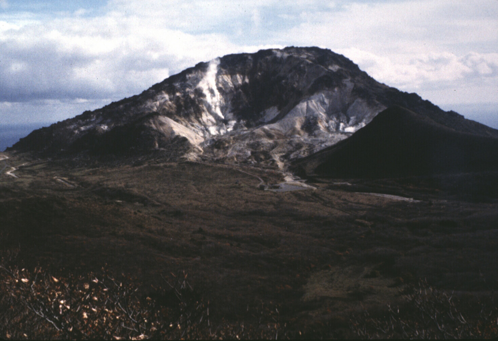 Esan volcano has lava dome at the eastern tip of the Oshima Peninsula. This is Hokkaido's southernmost active volcano and a minor phreatic eruption in 1846 produced a lahar that caused many fatalities. Active fumaroles are at a thermal area on the upper NW flank. Photo by Ken-ichi Arai, 1996 (Hokkaido University).