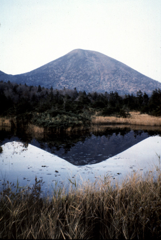The Takada-Odake cone, seen here from Suren swamp to the S, is one a group of cones and lava domes forming the Hakkodasan volcano group in northernmost Honshu. Takada-Odake and other nearby volcanoes were constructed within an 8-km-wide caldera. Photo by Takashi Kudo, 1996 (Hokkaido University).