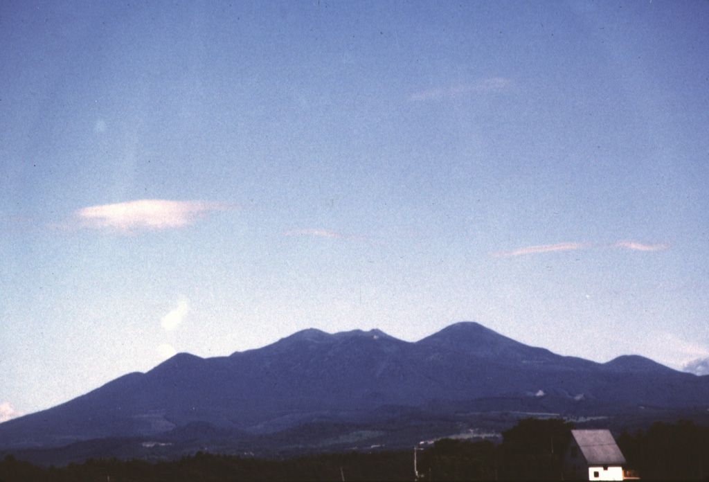 The Hakkodasan volcano group forms the skyline SE of the northern Honshu city of Aomori and is located within an 8-km-wide caldera. From left to right, the peaks are Takada-Odake, Akakuradake, Idodake, and Hakkoda-Odake (the highest peak of the complex, at the right-center).  Photo by Hisashi Sasaki, 1996 (Hokkaido University).