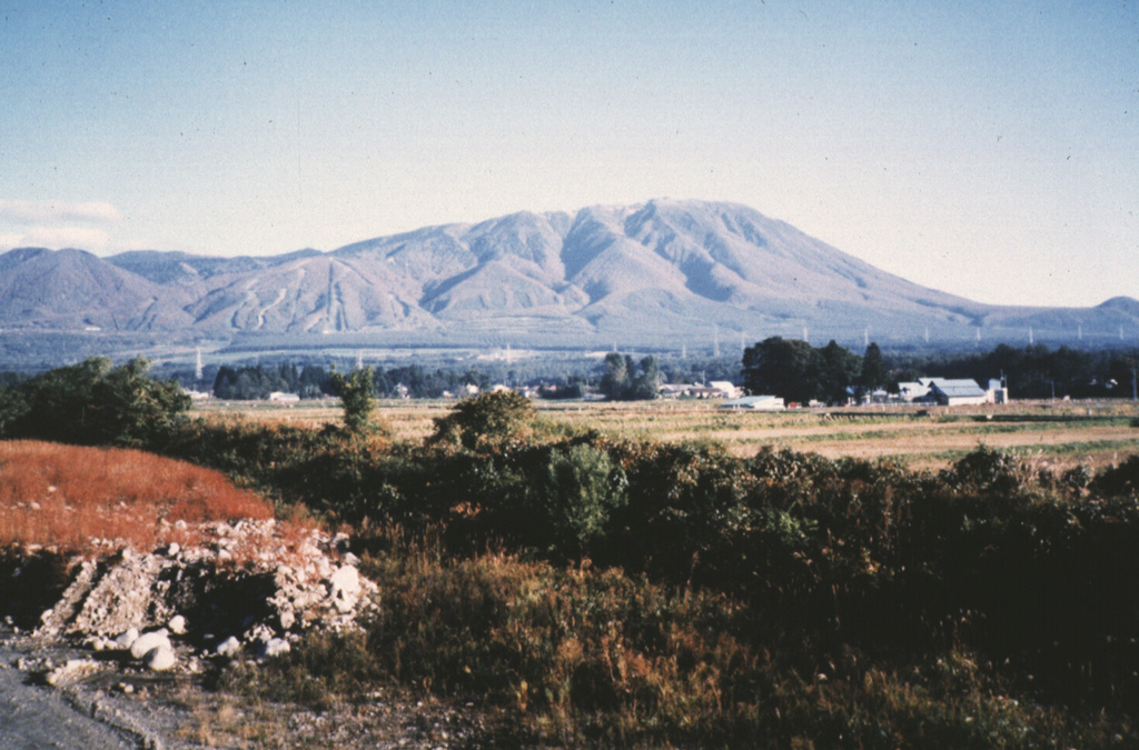 Iwatesan on Japan's northern island of Honshu, seen from the SW. The extensively-dissected Onigajo volcano forms the older, western part of Iwate and is truncated by the 1.8 x 3 km Nishi-Iwate caldera. The smoother slopes at the right are formed by ejecta from the younger Yakushidake cone, which was constructed on the eastern rim of the caldera. Photo by Hidenori Togari, 1994 (Hokkaido University).