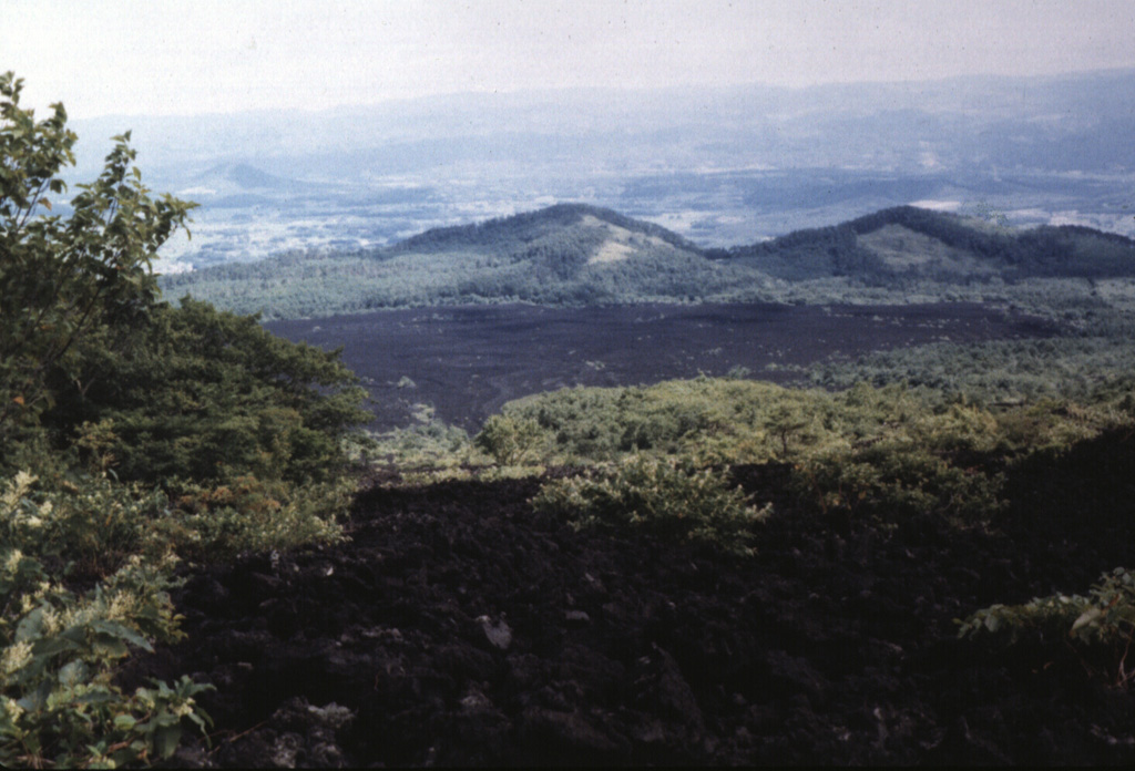 The unvegetated Yakebashiri lava flow descended the NE flank of the Yakushidake summit cone of Iwate volcano in 1719 CE. This is the youngest lava flow from Iwate, erupting from a vent on the upper NE flank. It traveled down to about the 550 m elevation, 3.5 km from the vent. Photo by Hidenori Togari, 1993 (Hokkaido University).