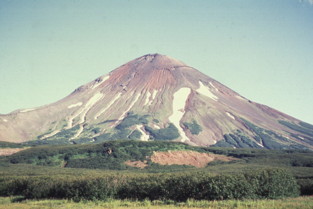 Iliinsky, seen here from the NW, was constructed beginning about 8,000 years ago within a 4-km-wide caldera about the same age as the adjacent Kurile Lake caldera. A period of explosive volcanism during the mid-Holocene lasted 1,000-1,500 years. Growth of the modern cone was completed during the late Holocene. Lava flows cover much of the northern flanks and a 1901 eruption produced a 1-km-wide crater on the NE flank. Photo by Oleg Dirksen, 1996 (courtesy of Vera Ponomareva, Institute of Volcanic Geology and Geochemistry, Petropavlovsk).