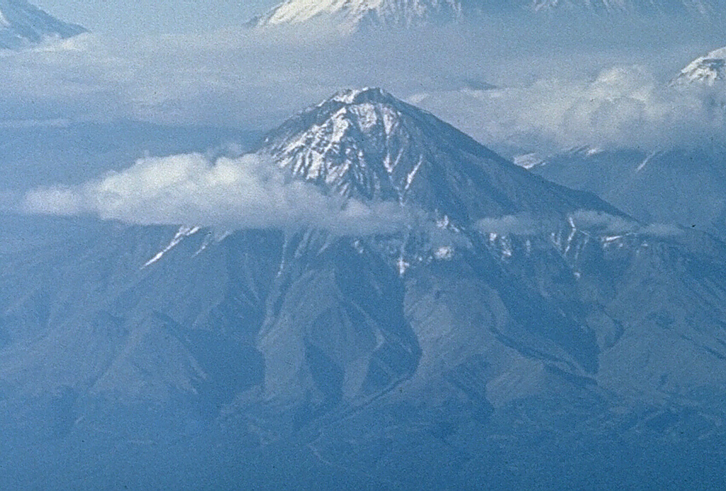 The Udina volcanic massif consists of two cones constructed along a WNW-ESE line at the south end of the Klyuchevskaya volcanic group, and SE of Tolbachik. The western cone is Bolshaya Udina, seen here from the south, and has a lava dome on the SW flank. The smaller Malaya Udina is out of view to the right. Photo by Oleg Volynets (Institute of Volcanology, Petropavlovsk).