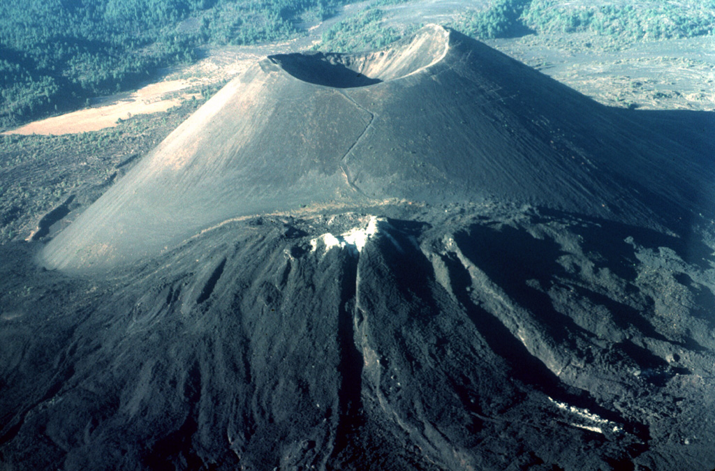 The renowned Parícutin scoria cone, which grew from a Mexican cornfield beginning in 1943, is one of the roughly 1,000 cones that form the massive Michoacán-Guanajuato volcanic field in central Mexico. White mineral deposits formed across the top of Nuevo Juatita in the foreground, a NE-flank vent that was the main source of lava flows during the last five years of the 1943-1952 eruption. Photo by Jim Luhr, 1997 (Smithsonian Institution).