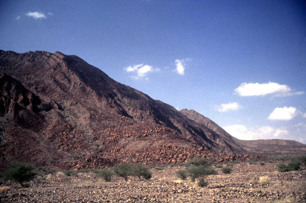 The lower SE flank of Alid consists of a series of rhyolitic lava flows of late-Pleistocene age. The uppermost units are lava flows of basaltic-to-andesitic composition. These rocks were uplifted by a silicic magma body that was intruded into the upper crust of the Danakil Depression during the Pleistocene. Photo by Wendell Duffield, 1996 (U.S. Geological Survey).