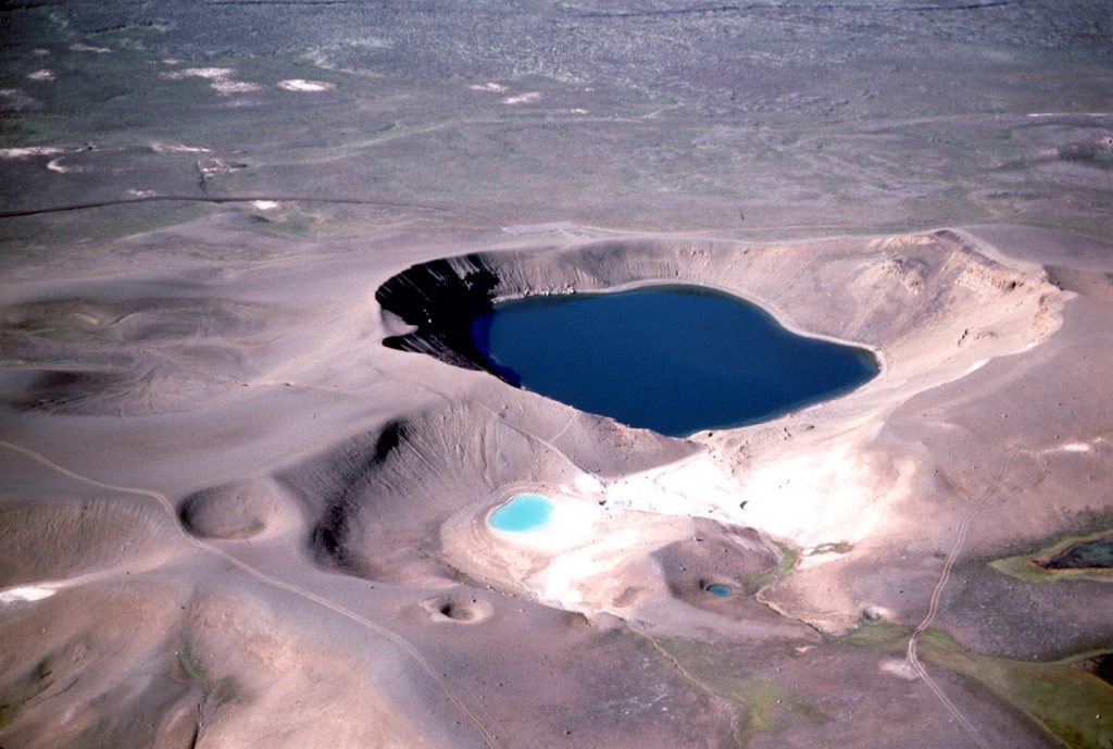 An explosive eruption in 1724 during which the 350-m-diameter Viti Crater and 14 other smaller craters formed marked the start of a five-year-long period of rifting and eruptions known as the "Myvatn Fires." Viti and neighboring smaller craters, seen here from the east, were formed during a brief eruption on 17-18 May 1724. The eruption and accompanying earthquakes caused people living on farms east of Myvatn lake to flee. Photo by Michael Ryan, 1984 (U.S. Geological Survey).