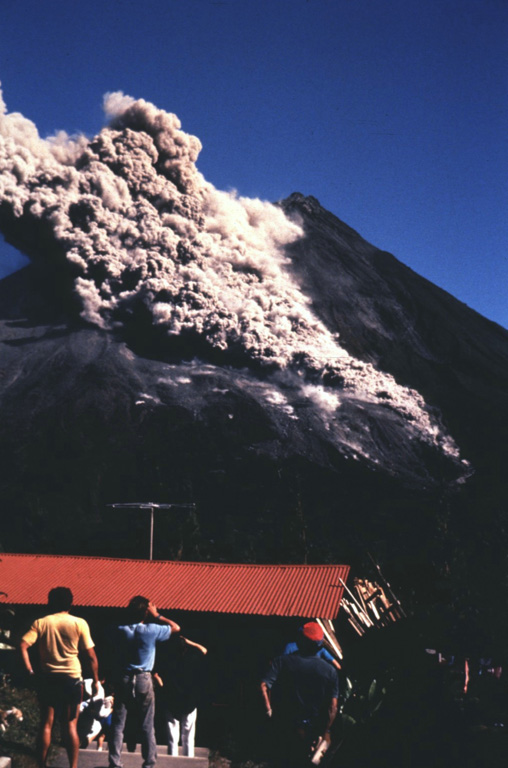 People at the Arenal Volcano Observatory watch a S-flank pyroclastic flow on 23 January 1991. Pyroclastic flows occasionally descended the flanks throughout the long-lived eruption that began in 1968. Photo by McDiarmid, 1991 (courtesy of William Melson, Smithsonian Institution).