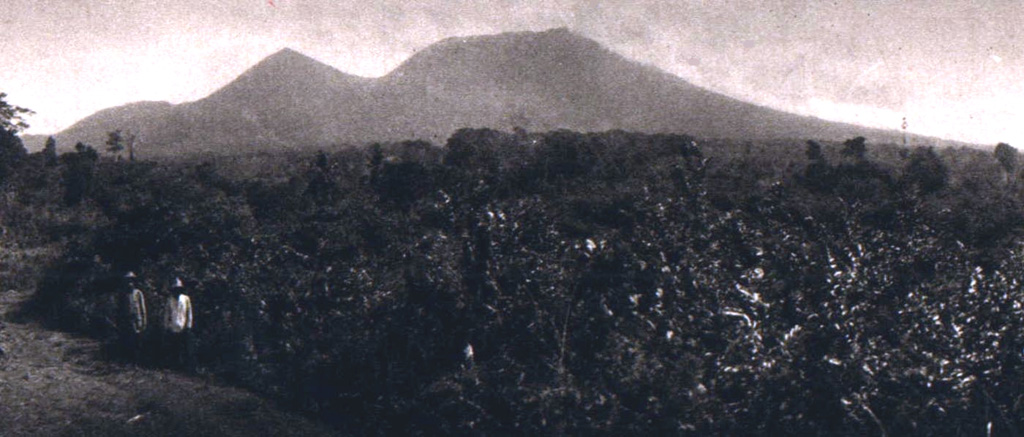 The peaks of Gunung Lewotobi have differing profiles, seen here from the SW. The summit of sharp-peaked Lewotobi Lakilaki (left) lies only 2 km NW of the broader summit of Lewotobi Perempuan. Both volcanoes have erupted during historical time. Photo published in Kemmerling 1929, 