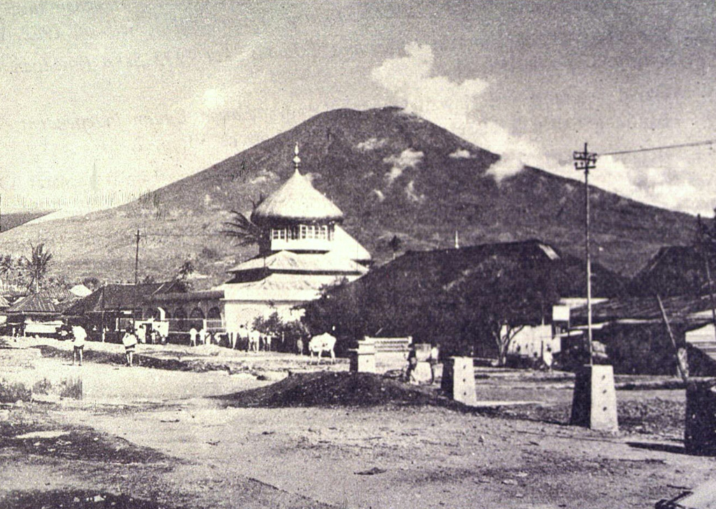 Gunung Dempo, one of the most active volcanoes of Sumatra, has a conical profile when viewed from the village of Pager Alam below the eastern flank of the volcano. The summit contains nested craters on its NW side. Photo by Sumarma Hamidi, 1972 (Volcanological Survey of Indonesia).