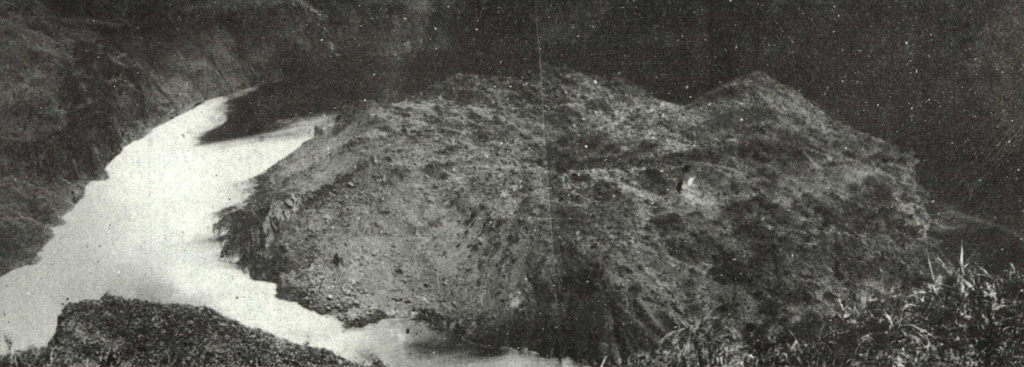 A lava dome erupted in 1931 that occupied the crater floor of Awu volcano is seen here prior to an eruption in 1966 that destroyed the dome.  The dome first rose above the surface of the crater lake in April 1931, following the rise of the crater lake water level and temperature beginning in December 1930.  The lava dome reached a height of 80 m by the end of the year.  The explosive destruction of the lava dome during the 1966 eruption produced a rain of lithic fragments that injured more than 1000 people. Photo published in Kusumadinata, 1979 (