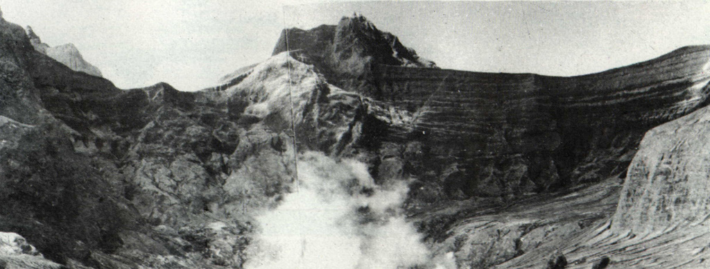 The empty, vegetation-free crater of Kelud volcano is seen here from the SW-side overflow on 20 May 1966, less than a month after a devastating eruption. A brief but powerful explosive eruption 26-27 April produced pyroclastic flows that swept 9 km from the summit and deadly lahars that reached up to about 30 km along river drainages on the south-NW sides. As with many other Kelud eruptions, it occurred without warning. No signs of an impending eruption were noted during a visit to the summit crater only two days earlier. Photo by I. Suryo, 1966 (Volcanological Survey of Indonesia).