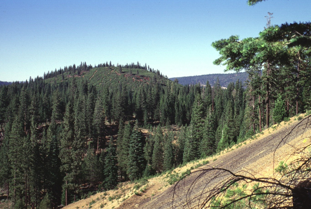 North Potato Butte, seen here from South Potato Butte, is a 65,000-75,000-year-old cinder cone located in the Hat Creek valley north of Lassen Peak.  The Potato Butte cinder cones are among a series of small Quaternary basaltic volcanic vents located between Lassen and Medicine Lake volcanoes. Photo by Lee Siebert, 1998 (Smithsonian Institution).