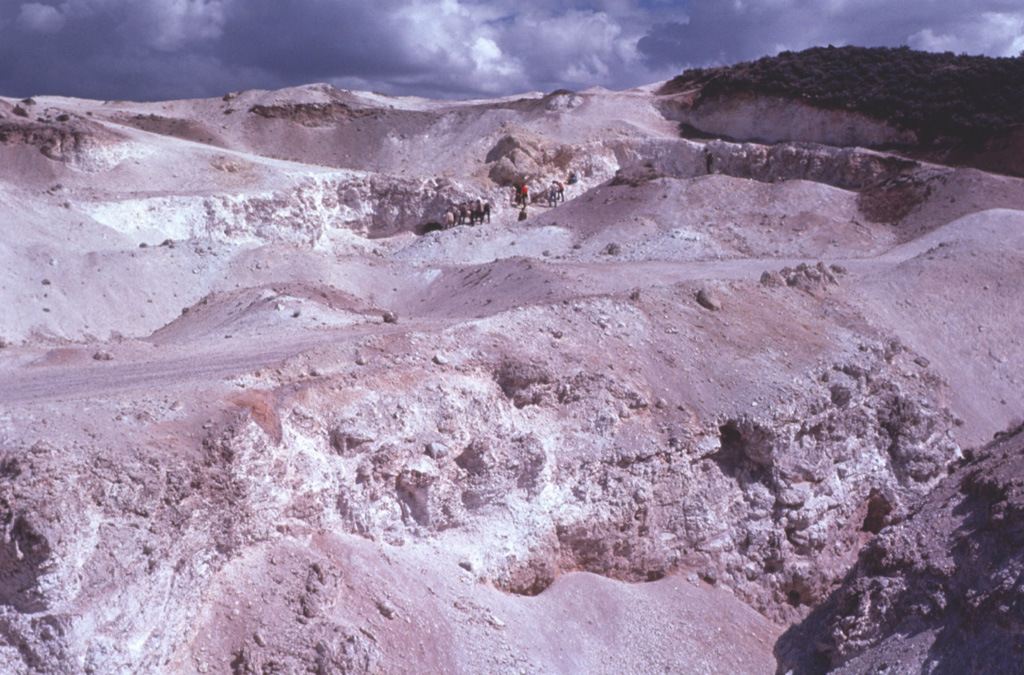 Extensive areas of hydrothermally altered rock occur at Steamboat Springs, a small volcanic field of rhyolitic lava domes and flows south of Reno, Nevada.  Volcanism ranges in age from 2.53 to 1.14 million years.  No eruptive activity has occurred during the Holocene, although the Steamboat Springs area contains about 50 active hot springs, numerous steam vents and fumaroles, and is an actively producing geothermal field.       Photo by Bill Rose, 1976 (Michigan Technological University).