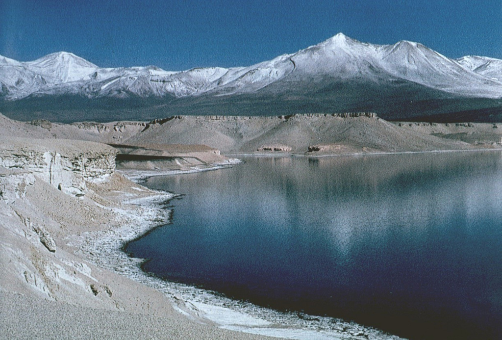 Dacitic pumice from Holocene eruptions of Nevados Ojos del Salado volcano lines the shores of Laguna Verde, NNE of the volcano.  The lake lies near the Chile-Argentina border, between Mulas Muertas and Falso Azufre volcanoes. Photo by Oscar González-Ferrán (University of Chile).