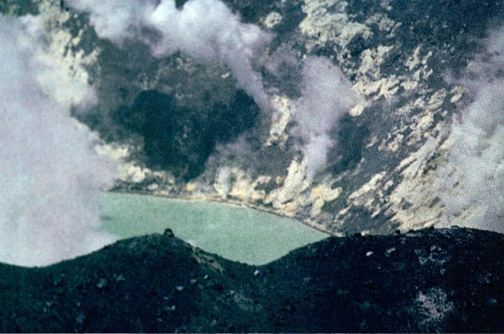 Steam plumes rise from abundant solfataras lining the shores of the acid crater lake where the eruptive activity took place at Tupungatito during the 1960s. Photo by Alejo Contreras (courtesy of Oscar González-Ferrán, University of Chile).