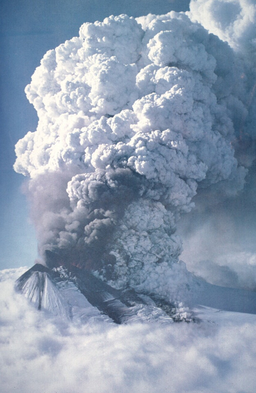 An eruption plume towers above Llaima volcano on May 17, 1994 in this aerial view from the west.  Lava fountains are visible along a 550-m-long fissure on the upper SSW flank that fed a subglacial lava flow.  Explosive plumes May 17-19 produced ashfall primarily to the ESE.  Lahars and flooding associated with the eruption cut roads and destroyed five bridges along the Calbuco River.  A dark-gray plume was observed on June 14 or 15, and a new eruptive episode August 25-30 produced ashfall primarily to the SE and north.   Photo by Hugo Moreno, 1994 (published in González-Ferrán, 1995).