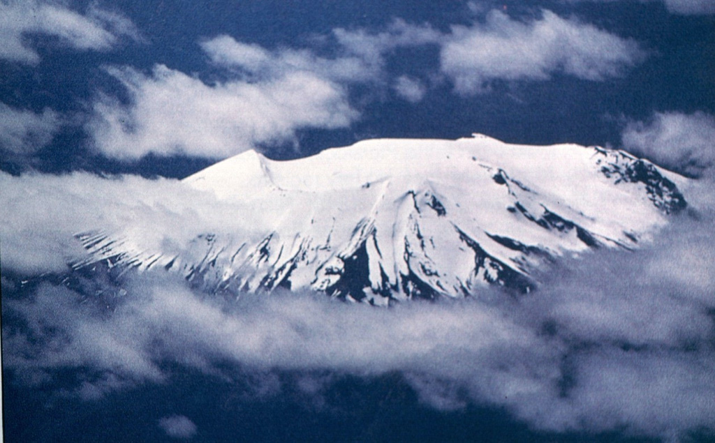 Volcán Mentolat is an ice-filled 6-km-wide caldera in the central part of Magdalena Island, across the Puyuhuapi strait from the town of Puerto Cisnes.  A young-looking andesitic lava flow on the west side of the volcano may be its most recent product.  Historical reports describe an eruption at the beginning of the 18th century that could refer to this lava flow. Photo by Oscar González-Ferrán (University of Chile).