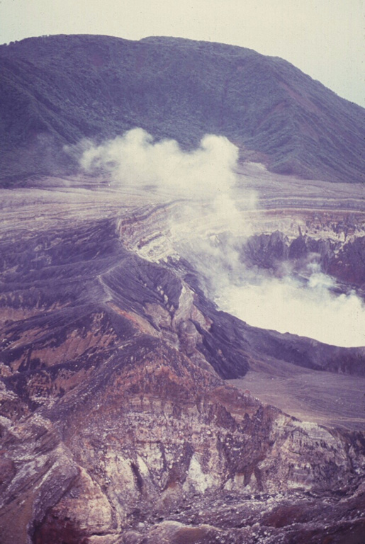 Von Frantzius cone rises beyond the degassing active crater of Poás. This cone was constructed near the northern margin of the inner caldera. Photo by Guillermo Alvarado (Instituto Costarricense de Electricidad).