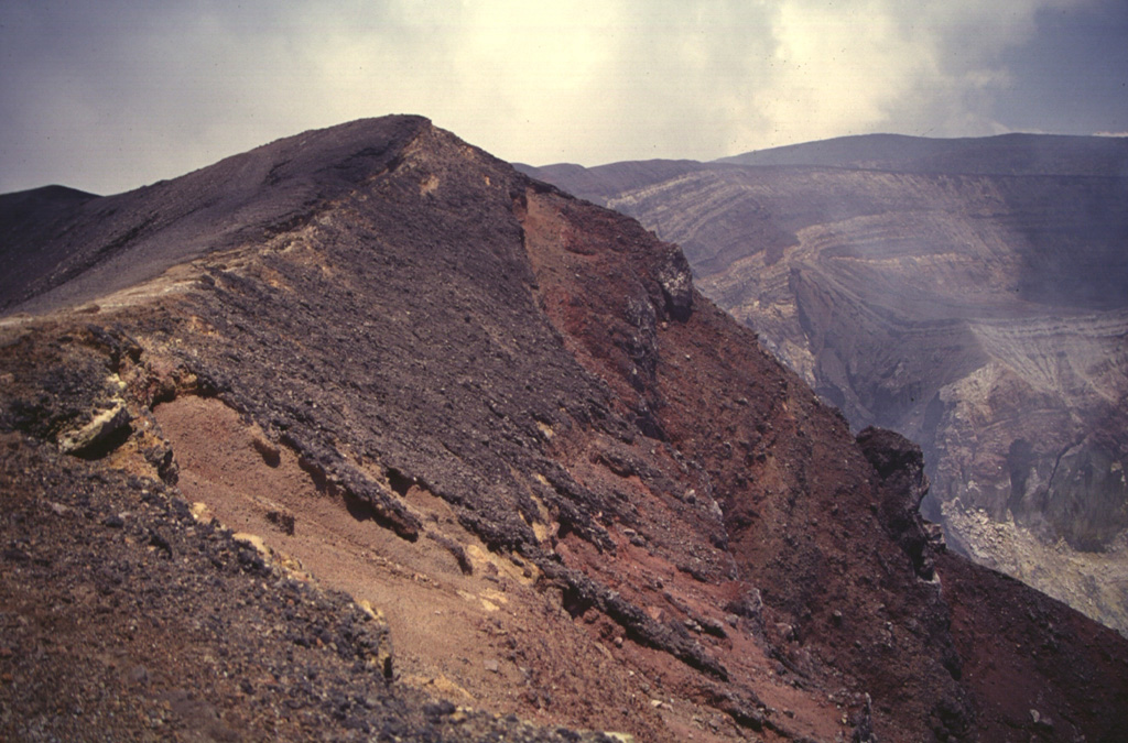 Scoria from the 1904 eruption of Santa Ana form the darker deposits across the summit crater rim. The first of two 20th-century eruptions from Santa Ana began on 12 January, lasted for about two weeks, and included phreatomagmatic explosions. Photo by Carlos Pullinger, 1996 (Servicio Nacional de Estudios Territoriales, El Salvador).