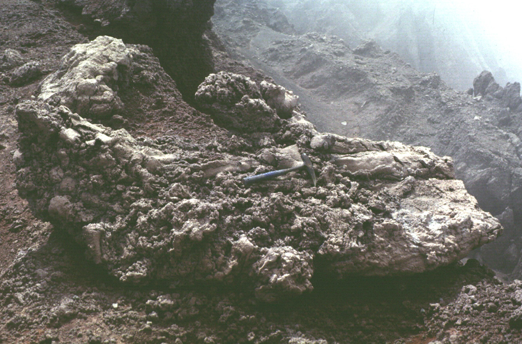 This large lava bomb in the summit crater of San Miguel was probably erupted in 1976.  Lava fountaining took place in the central crater, which was active December 2-12, 1976 and February 28 to March 1, 1977, constructing a new spatter cone.  Ashfall in December 1976 caused some crop damage.  Photo by Carlos Pullinger, 1996 (Servicio Nacional de Estudios Territoriales, El Salvador).