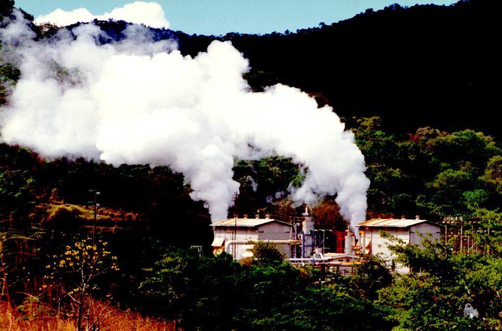 Steam clouds pour from the Berlín 2 well.  The Berlín geothermal field on the NW flank of the Tecapa volcanic complex is one of the largest in El Salvador.  The Berlín 2 site has an installed capacity of 55 MW with a potential of 55-150 MW.  Measured well temperatures ranged from 240-300 degrees Centigrade. Photo courtesy of Comisión Ejecutiva Hidroeléctricia del Río Lempa (CEL).