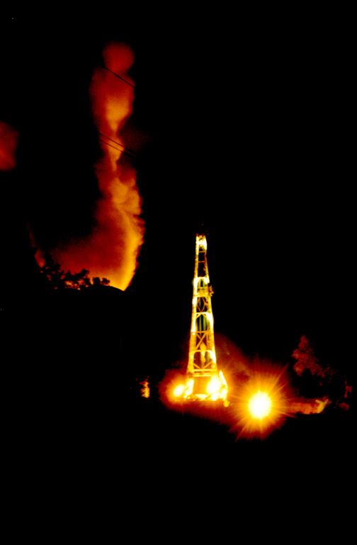 A night-time view shows a drill site at the Berlín geothermal area on the NW flank of Tecapa volcano.  The Berlín Boca Pozo 1 site has an installed capacity of 10 MW and came on line in 1991.  The El Tronador site began commercial operation in 1992 and generated 8 MW of power. Photo courtesy of Comisión Ejecutiva Hidroeléctricia del Río Lempa (CEL).