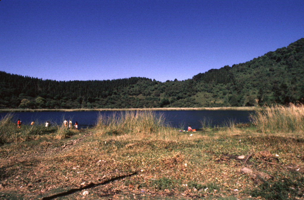 Laguna Verde is a 500-m-wide lake that partially fills the 1-km-wide summit crater of Cerro Laguna Verde in the Apaneca Range. Laguna Verde is a Pleistocene-age edifice within the Concepción de Ataco caldera. Flank craters on Laguna Verde volcano are among the youngest volcanic centers of the Apaneca Range. Photo by Giuseppina Kysar, 1999 (Smithsonian Institution).