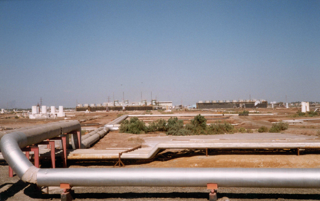 The Cerro Prieto geothermal field on the Colorado River delta in NW México, seen here in 1998, is a  large producing geothermal field. This view shows the Unit 1 power plant. Exploration drilling began in 1959 and by the mid-1980s more than 100 wells had been drilled to depths as great as 3.5 km. Despite few surface volcanic features, the hydrothermal system covers an area of more than 100 km2. Photo by Pat Dobson, 1998 (Lawrence Berkeley National Laboratory).