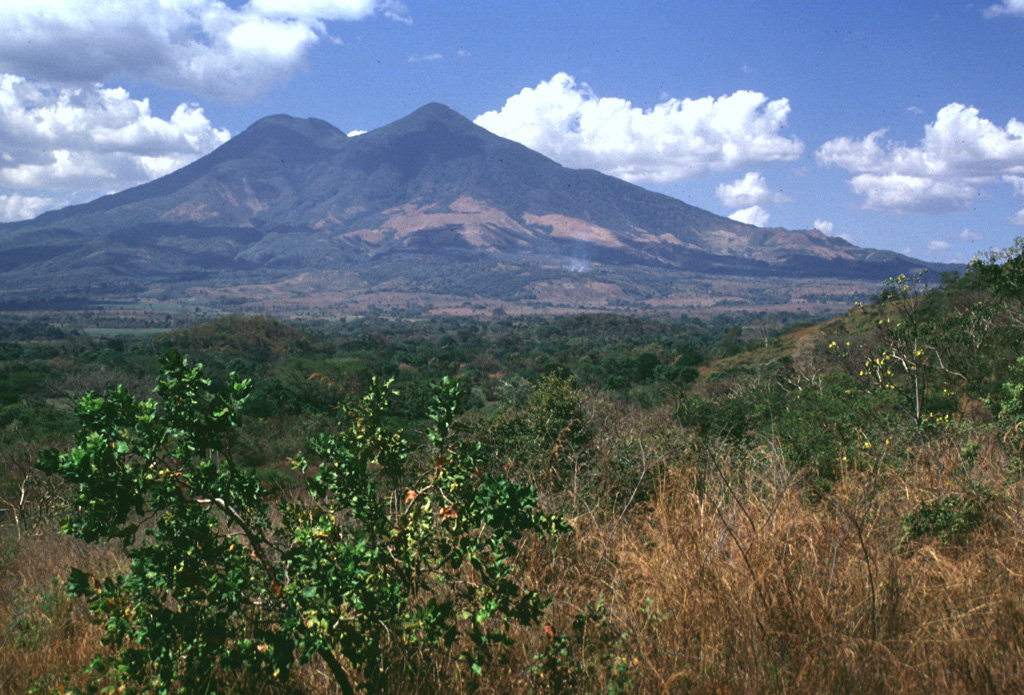 San Vicente is seen here from the SE. The modern edifice is largely constructed of thick lobate lava flows that originated primarily from summit vents and a vent on the eastern flank. Photo by Lee Siebert, 1999 (Smithsonian Institution).