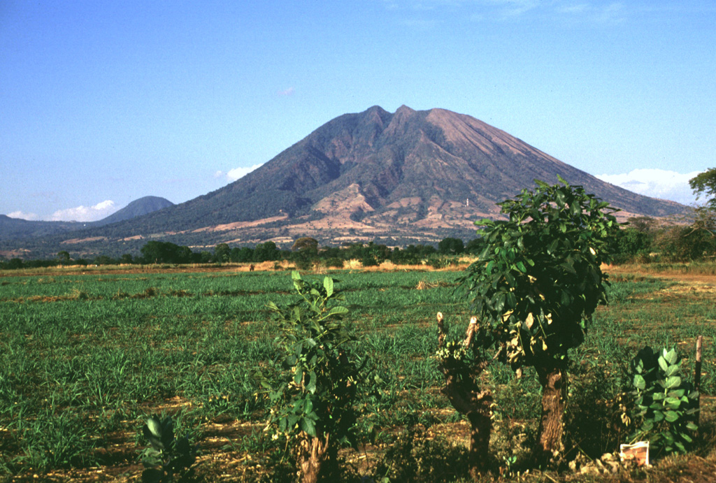 Usulután is part of a cluster of volcanoes north of the Pacific coastal plain between San Vicente and San Miguel, seen here from the SSW. Cerro Oromontique, the small peak to the left, formed on the flank of El Tigre. Relatively young lava flows are on the southern flank. Photo by Lee Siebert, 1999 (Smithsonian Institution).