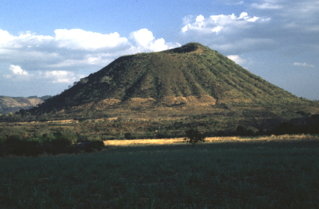 Cerro Singüil is rises 250 m above the floor of El Salvador's interior valley and is seen here from the NW, along the Pan-American highway. Photo by Rick Wunderman, 1999 (Smithsonian Institution).