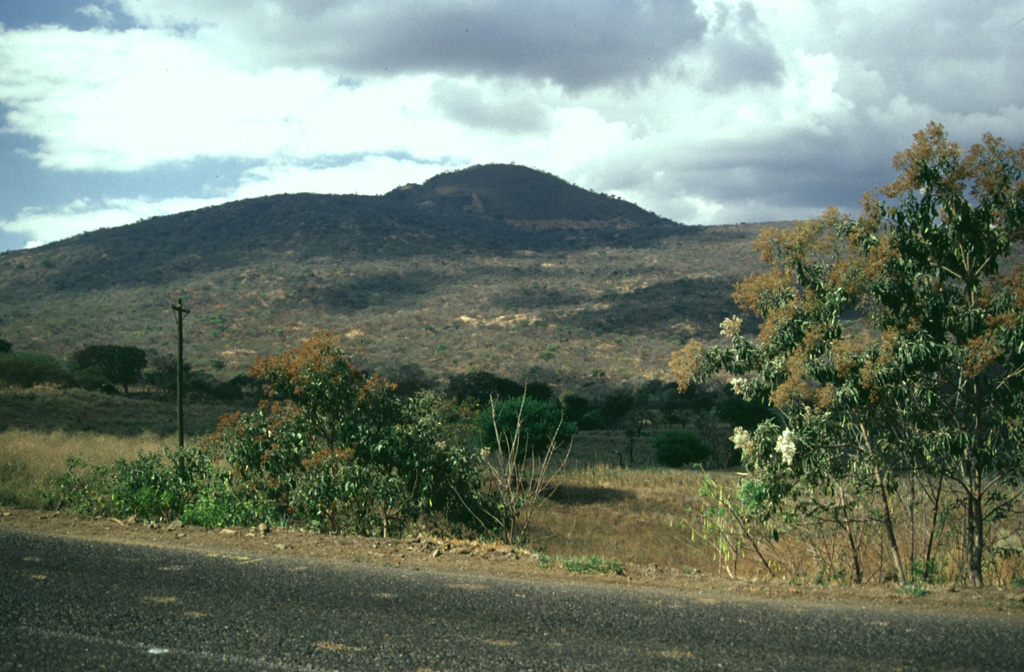 Volcán Las Viboras, north of Volcán Chingo, is a part of the Chingo volcanic field in Guatemala. Las Viboras (seen here from the north) contains a scoria cone at the summit. Recent lava flows of estimated Holocene age were erupted along this same fault on the N flank of Las Viboras and on the NW flank. Photo by Giuseppina Kysar, 1999 (Smithsonian Institution).