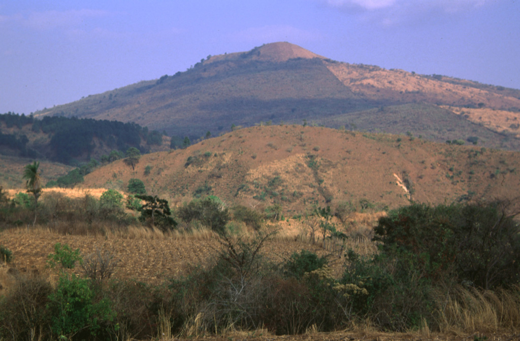 Volcán Flores rises above foothills on its western flank. The volcano is one of the largest of a group of small volcanoes behind the volcanic front in SE Guatemala and rises about 600 m above its base. Photo by Rick Wunderman, 1999 (Smithsonian Institution).