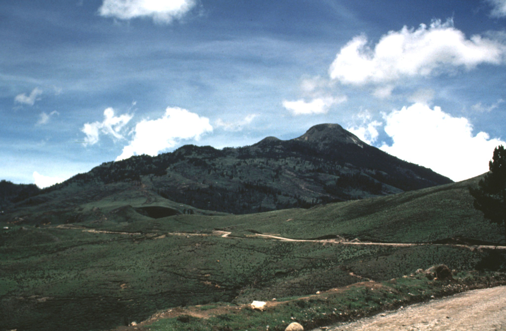 The NE side of Tajumulco volcano has gentler slopes and more extensive agricultural use than the NW side. Tajumulco lies NW of the main tourist areas in the Central Highlands and is infrequently visited. The volcano is located closer to Tacaná volcano on the México/Guatemala border than it is to other Guatemalan volcanoes. Photo by Bill Rose, 1986 (Michigan Technological University).