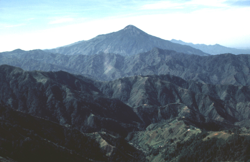 Tajumulco is seen here from the NNW. It rises above deeply eroded valleys within plutonic and Tertiary volcanic rocks. Prior to this 1986 photo there had been several unconfirmed reports of eruptions. Photo by Bill Rose, 1986 (Michigan Technological University).