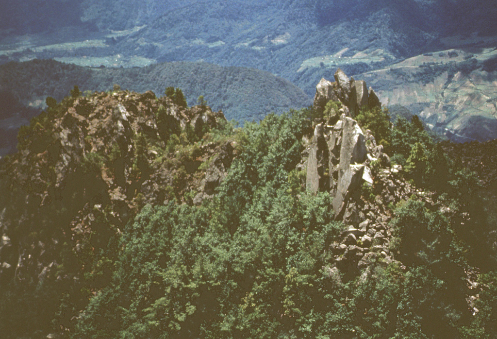 Lava spines are seen here along the summit ridge of Cerro Quemado, the youngest of a series of lava domes erupted along the margins of Almolonga volcano. The early stages of the Cerro Quemado complex eruptions produced a sequence of lava flows and domes erupted from at least eight vents. During the later stages about 1,150 years ago the summit dome of Cerro Quemado was emplaced following failure of the summit area. An eruption took place from an E-flank vent in 1818. Photo by Bill Rose, 1972 (Michigan Technological University).