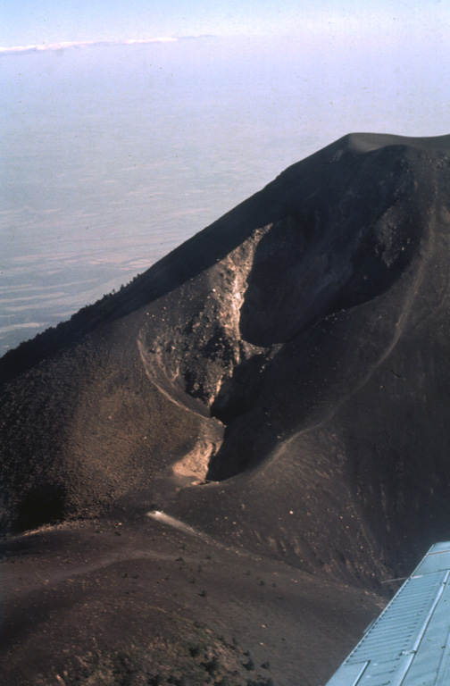 This elongate crater is along the northern flank of Pico Mayor, the summit of Acatenango. The first well-documented eruption of Acatenango took place from this N-flank vent beginning 18 December 1924. The eruption continued until 7 June 1925. On 14 March 1925 ash fell as far away as Pochuta. Photo by Bill Rose, 1980 (Michigan Technological University).