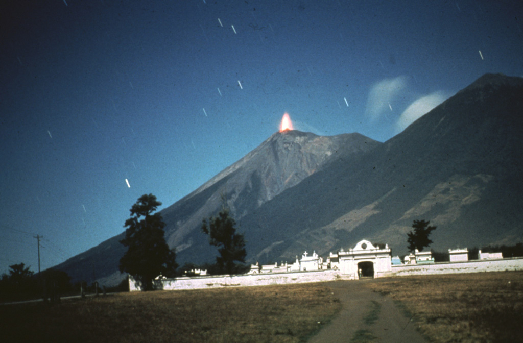 A time exposure taken in 1978 from the NE shows incandescent lava ejected at the summit of Fuego. Intermittent minor eruptions took place from 11 September 1977 to 8 August 1979, sometimes producing pyroclastic flows and lava flows. Photo by Bill Rose, 1978 (Michigan Technological University).