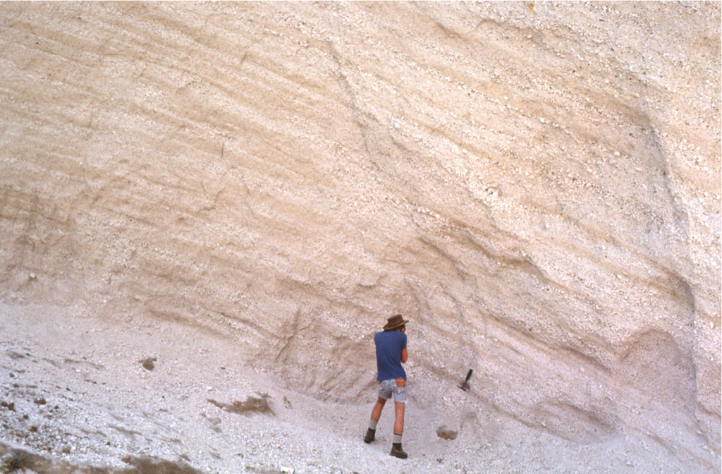 Massive airfall pumice deposits blanket the countryside around Siete Orejas volcano.  The coarse white rhyodacitic pumice creates the impression of snowfall over broad areas, and on the volcano itself the mantle is so thick that underlying lavas are rarely exposed.  Eruption of the airfall pumice was followed by the production of massive pumiceous pyroclastic flows that filled the valley of Quetzaltenango to depths up to about 75 m. Photo by Bill Rose, 1981 (Michigan Technological University).