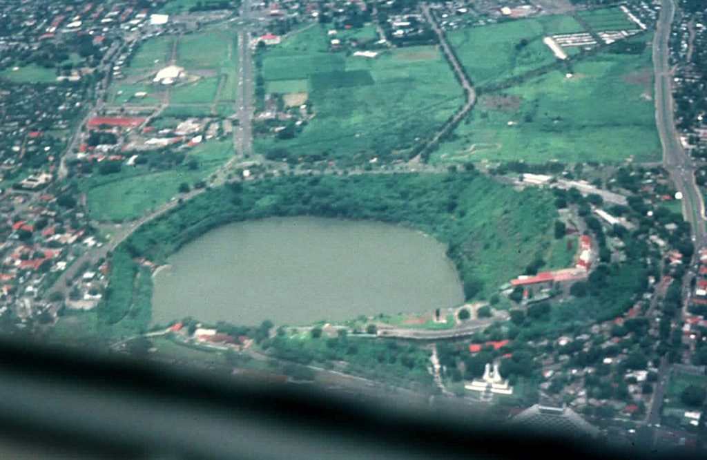 Laguna de Tiscapa partially fills a 700-m-wide maar on the outskirts of Managua, Nicaragua's capital city.  The maar was constructed along a major fault that cuts through Managua.  The rim of the crater overlooks the center of Managua and consequently has been the site of military fortifications dating back to the 18th century. Photo by Jaime Incer, 1996.
