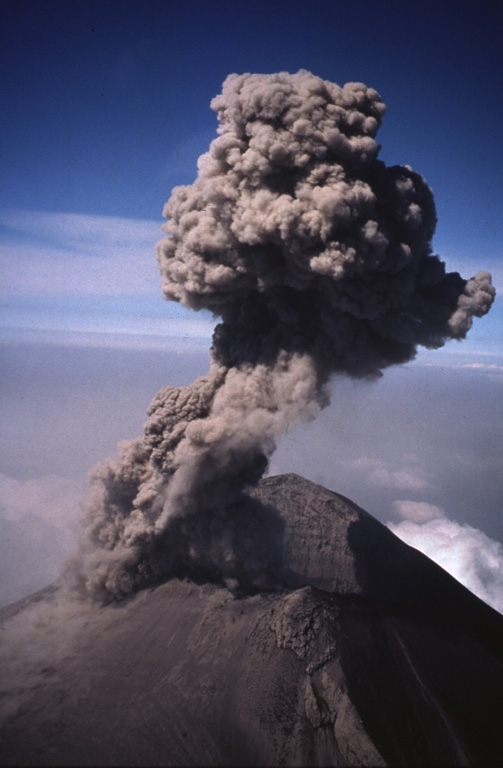 An ash plume rises above the crater of Popocatépetl on 21 February 1995. A phreatic eruption on 21 December 1994 ended a quiescent period that lasted roughly half a century. The eruption produced light ashfall in the city of Puebla, 45 km E. Intermittent ash eruptions, such as the one shown here, continued until May 1995 and then resumed in March 1996.  Photo by Hugo Delgado-Granados, 1995 (Universidad Nacional Autónoma de México).