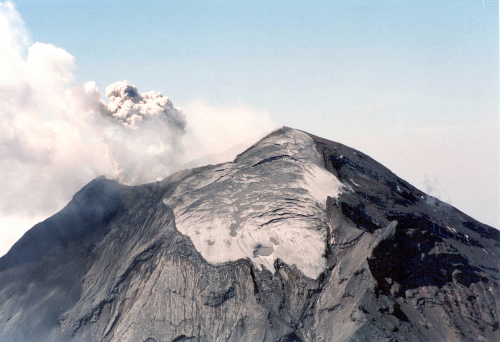 The north side of Popocatépetl with the Ventorrillo glacier near the summit is shown here during an explosion on 26 April 1996. To the lower right is the El Ventorrillo peak at around 5,000 m elevation. Photo by Hugo Delgado-Granados, 1996 (Universidad Nacional Autónoma de México).