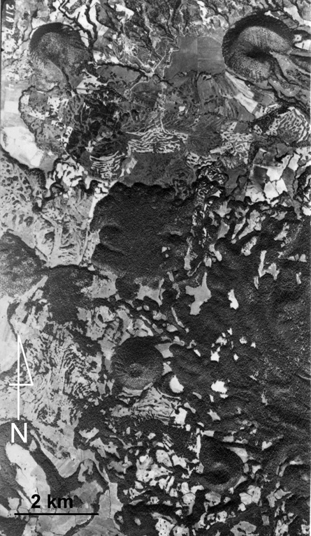 This aerial photo shows part of the Michoacan-Guanajuato volcanic field. Cerro el Pueblito (upper left), radiocarbon dated to about 29,000 years ago, produced the lava flow that extends eastward across the photo that flowed around the older Cerro las Cabras cone to the right. South of this lava flow is the La Vibor lava flow. Cerro Arena is the cone near the center of the photo.  Aerial photo by Comisión de Estudios del Territorio Nacional (CETENAL).