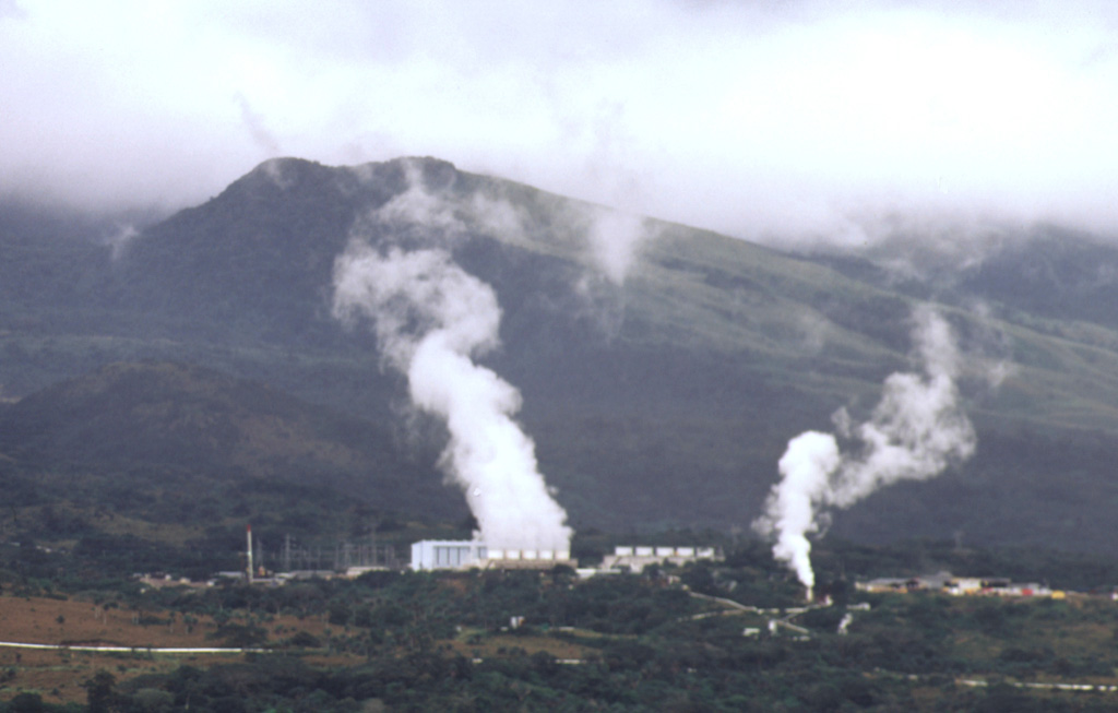 Steam plumes rise from power plants of the Miravalles geothermal project in 1998, which began production in 1994. Photo by Paul Kimberly, 1998 (Smithsonian Institution).