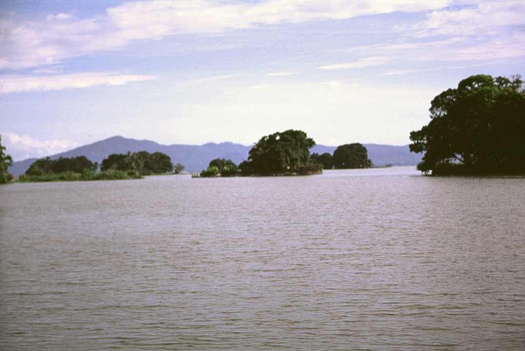 These small forested islands are hummocks of a large debris avalanche from Mombacho volcano that swept into Lake Nicaragua.  The horizon is formed by Isla Zapatera volcano, SE of Mombacho. Photo by Lee Siebert, 1998 (Smithsonian Institution).
