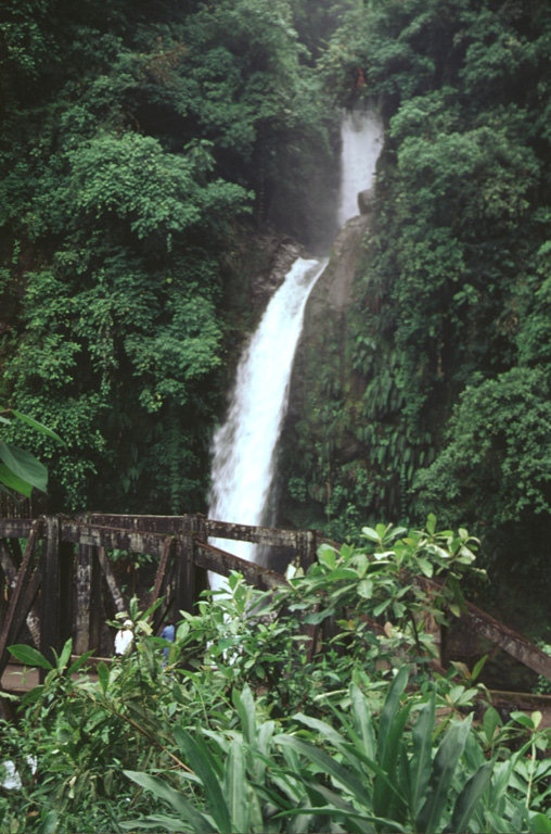 Radial drainages draped with lush vegetation descend the flanks of Poás volcano.  These waterfalls on the Río La Paz lie on the eastern flank of Poás along the road between the central valley and the Atlantic coastal plain.  NE-flank drainages empty into the Río Sarapiquí and then the Río San Juan en route to the Carribean Sea.  Poás is the centerpiece of a national park that preserves highland forests and abundant wildlife.  Photo by Paul Kimberly, 1998 (Smithsonian Institution).