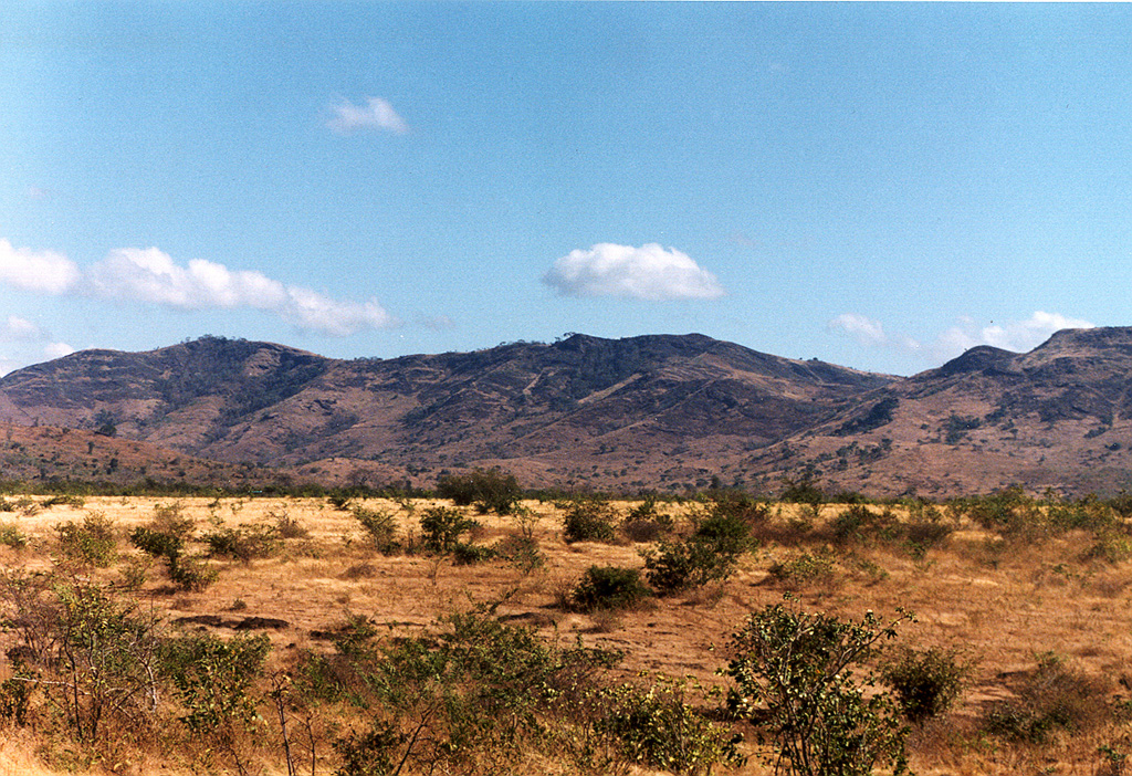 Cerro San Jacinto, also known as Cerro San Jacinto Viejo, is a small stratovolcano of probable early Pleistocene age constructed along the eastern margin of the Nicaraguan central graben east of Lake Managua.  The central part of the volcano is seen here from the floor of the Nicaraguan depression along the road past Las Banderas.  A large central depression is surrounded on the north and east by a horseshoe-shaped ridge, which is a remnant of a caldera rim.   Photo by Benjamin van Wyk de Vries (Open University).