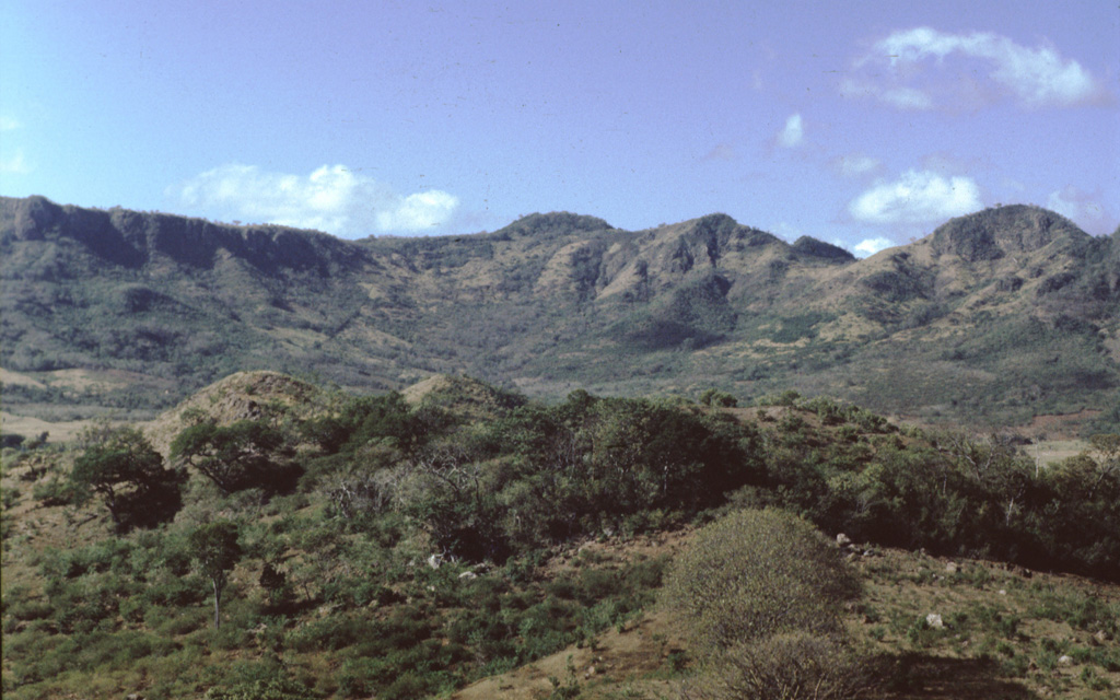 Las Lajas is the largest Quaternary volcano east of the Nicaraguan graben. The broad edifice contains a 7-km-wide, 650-m-deep caldera, with the SSW rim forming the horizon here. In the foreground are part of a group of five lava domes that are located in the center of the caldera. Additional domes are on the outer flanks.  Photo by Benjamin van Wyk de Vries (Open University).